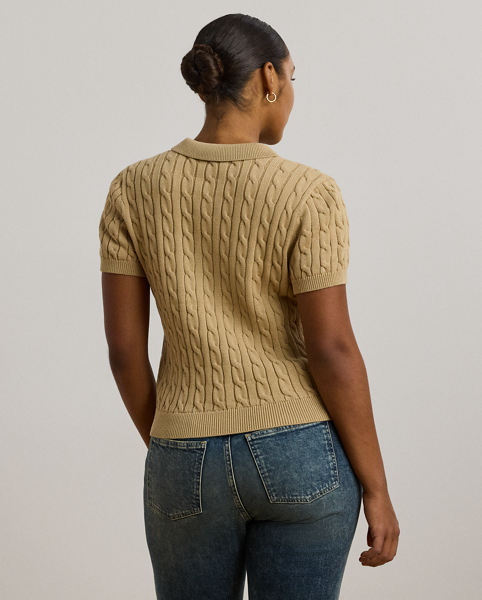 Crafted from combed cotton for a soft hand, this piece unites a timeless Polo shirt silhouette with the comfort of a cable-knit jumper. It's detailed with Lauren's signature embroidered logo and "LRL"-engraved buttons.