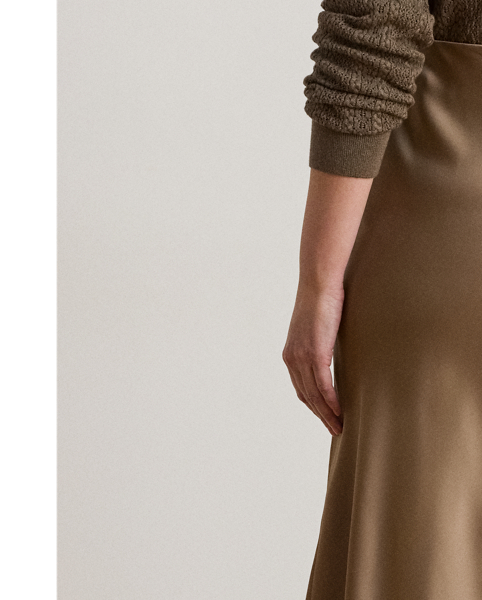 A staple piece that can be easily dressed up or down, this midi skirt is rendered in silky satin charmeuse for a fluid drape and subtle sheen.