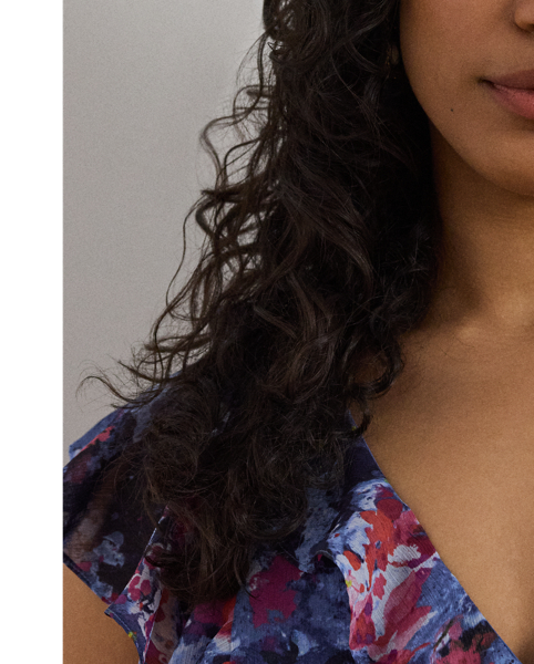 Airy crinkle georgette, ruffle trim and flutter sleeves bring effortless movement to this midi dress, which showcases the season's painterly abstract motif.