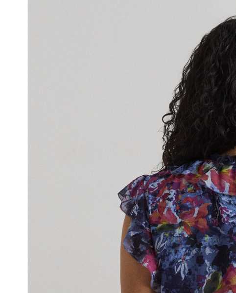 Cascading ruffles, flutter sleeves and crinkle georgette bring an airy look and feel to this tie-neck blouse, which showcases the season's painterly abstract motif.