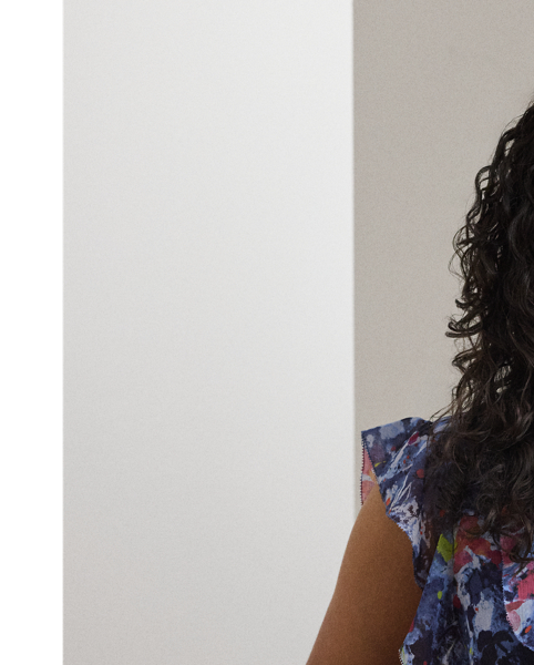 Cascading ruffles, flutter sleeves and crinkle georgette bring an airy look and feel to this tie-neck blouse, which showcases the season's painterly abstract motif.