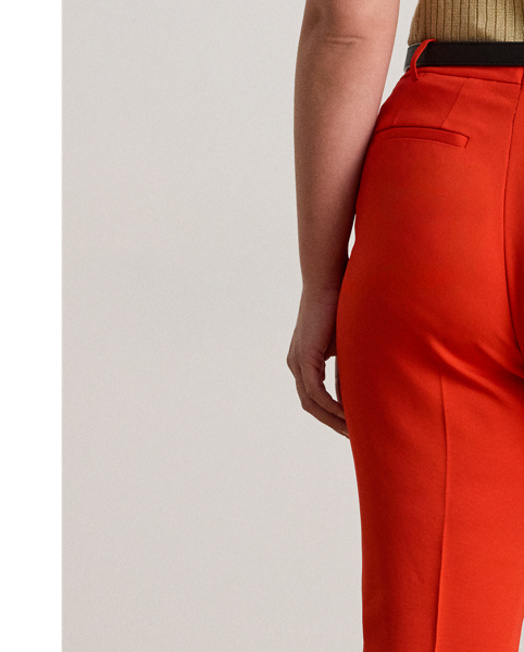 Tailored from smooth stretch cady, these slim trousers are detailed with back waist darts and crisp creases on each leg for a polished finish.