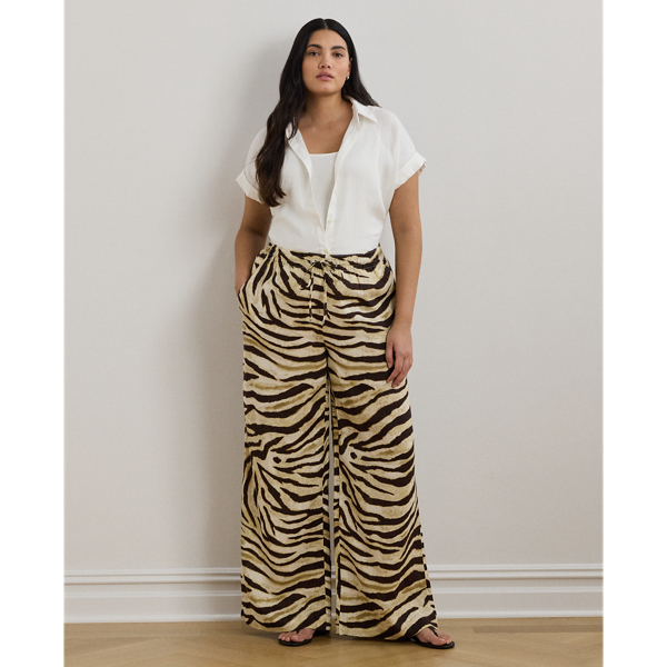 Crafted with airy linen for maximum comfort, these wide-leg drawcord trousers are refreshed with the season's eye-catching zebra print.