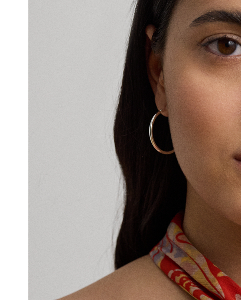 Featuring a bamboo-inspired metal embellishment at the neckline, this enchanting halter dress is crafted from crinkle georgette printed with the season's painterly floral motif.