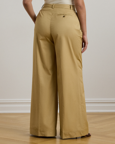 A timeless essential, these wide-leg trousers are detailed with front waist pleats, crisp creases and folded cuffs for a tailored look. This style is crafted from soft, lightweight cotton twill and has a signature horn-effect buttoned closure for a sophisticated finish.