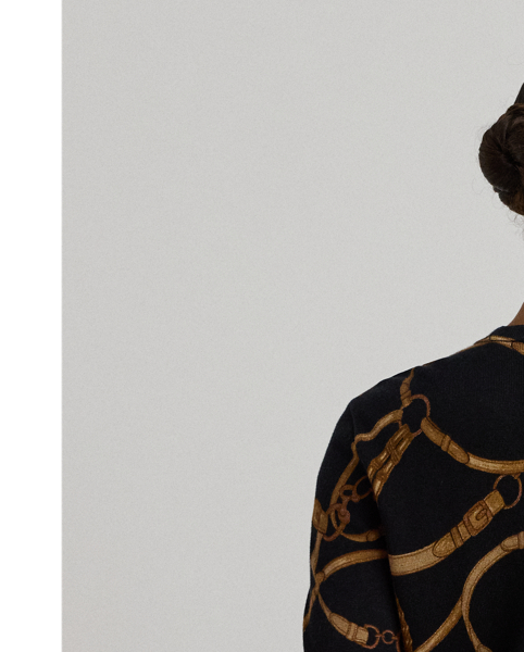 Made with a soft cotton blend for a comfortable feel, this slim-fitting crewneck jumper showcases the season's equestrian-inspired belting print.