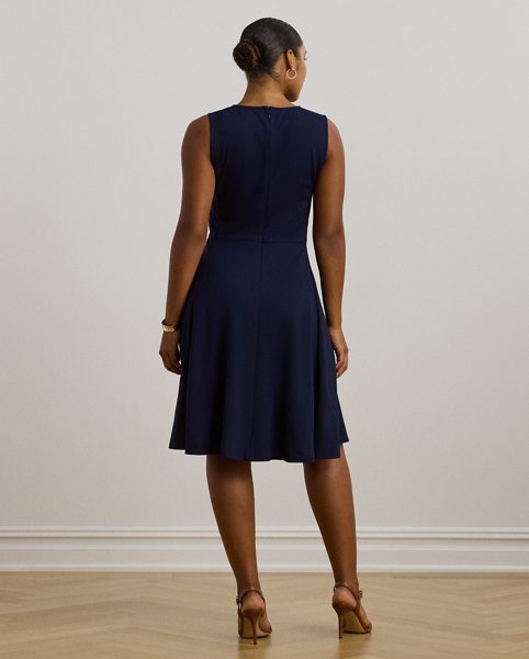 Straddle-stitched princess seams accentuate the fit-and-flare silhouette of this sleeveless dress, which is crafted with smooth, stretch-infused ponte.