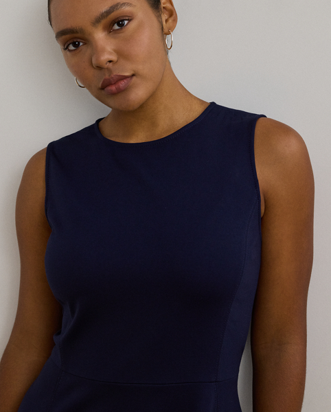 Straddle-stitched princess seams accentuate the fit-and-flare silhouette of this sleeveless dress, which is crafted with smooth, stretch-infused ponte.