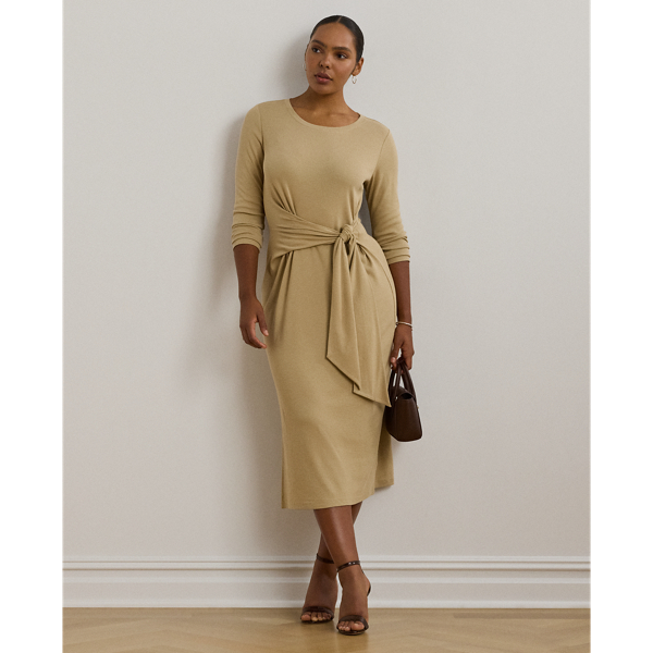 Rib-knit with a soft stretch-cotton blend, this long-sleeve crewneck dress is cut for a slim-fitting silhouette and a calf-grazing midi length. A tie-front design at the waist adds contemporary flare, while a skirt slit affords ease of movement.