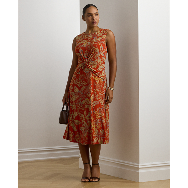 An eye-catching twist-front detail on the bodice serves as the focal point of this cap-sleeve dress, which is crafted from stretch-infused jersey for a soft feel and ease of movement. This version displays a painterly floral motif against a vibrant red backdrop.