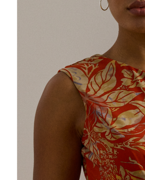 An eye-catching twist-front detail on the bodice serves as the focal point of this cap-sleeve dress, which is crafted from stretch-infused jersey for a soft feel and ease of movement. This version displays a painterly floral motif against a vibrant red backdrop.