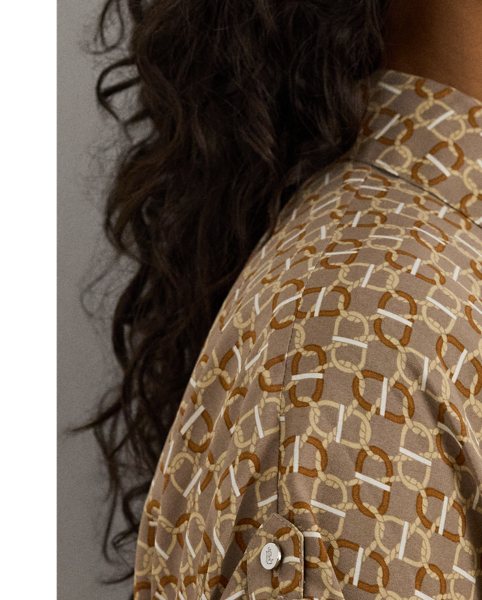 Crafted from airy crepe de chine, this dress balances a spread collar and roll-tab sleeves with a feminine surplice neckline to create a look that is casual yet refined. Detailed with "LRL"-engraved buttons, this version displays a stylised, equestrian-inspired geometric print.