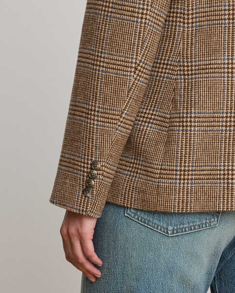 Shoulder pads, princess seams and waist darts enhance the streamlined silhouette of this blazer, which is crafted with soft wool-blend twill. Decorated with signature horn-effect buttons, this style showcases a refined Glen plaid pattern.