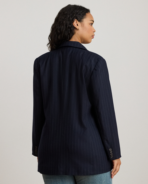 Slender, yarn-dyed pinstripes punctuate the structured silhouette of this sophisticated double-breasted blazer, which is finished with peak lapels and signature horn-effect buttons.