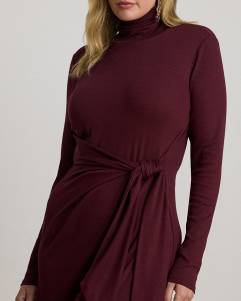 Rib-knit from a soft stretch-cotton blend, this roll neck dress is cut for a slim-fitting silhouette and a calf-grazing midi length. A tie-front design on the waist adds contemporary flare to this refined piece, while slits on the hem afford ease of movement.