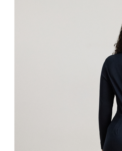 Crafted from smooth stretch jersey, this surplice jumpsuit features a wide-leg silhouette with a wrap-style overlay at the trousers and an equestrian-inspired faux-leather buckled tab at the waist.