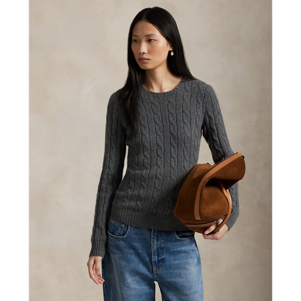 Inspired by fishermen's ropes, the cable-knit jumper's defining motif has transformed from a practical, hard-wearing construction into a symbol of collegiate style. This version is crafted from luxuriously soft cashmere, which is spun and dyed in a renowned Italian mill.