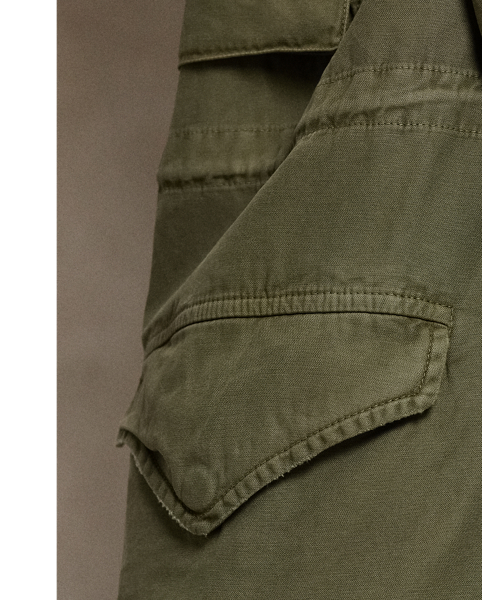 Polo’s version of the classic field jacket is woven from cotton twill and treated for nuances in shading, giving each piece a unique character. It features surplus-inspired pocketing, buttoned shoulder epaulettes and our signature logo patch embroidered on the chest.