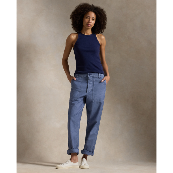 The Ricky Trouser combines smooth cotton sateen with adjustable buttoned tabs on the waist and utility-inspired pocketing. This version has been specially dyed to create distinct nuances in shading, which give each piece a unique character and a slightly faded, timeworn look.