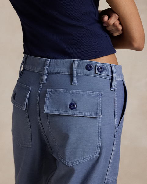 The Ricky Trouser combines smooth cotton sateen with adjustable buttoned tabs on the waist and utility-inspired pocketing. This version has been specially dyed to create distinct nuances in shading, which give each piece a unique character and a slightly faded, timeworn look.