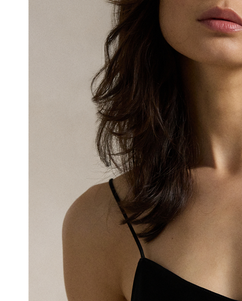 Cut on the bias, this double-faced satin slip dress has a midi-length silhouette with a fluid drape and adjustable spaghetti straps for a customisable fit.