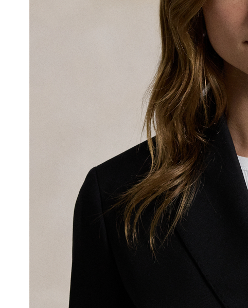 Tailored with Italian stretch wool faille, this blazer has a double-breasted silhouette with signature helmet-and-mallet-engraved metal buttons.