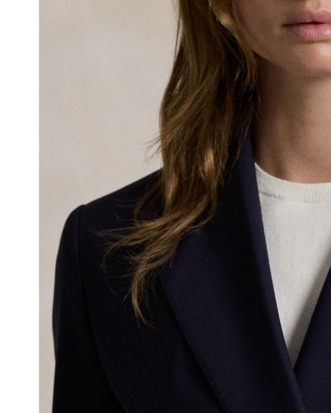 Tailored with Italian stretch wool faille, this blazer has a double-breasted silhouette with signature helmet-and-mallet-engraved metal buttons.