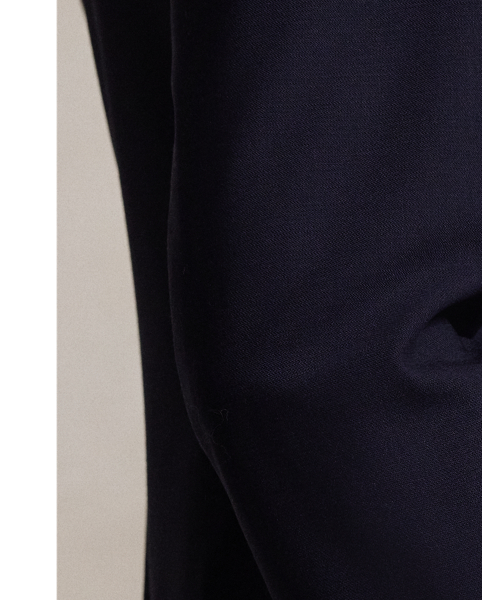 Tailored with Italian stretch wool faille, this blazer has a double-breasted silhouette with signature helmet-and-mallet-engraved metal buttons.