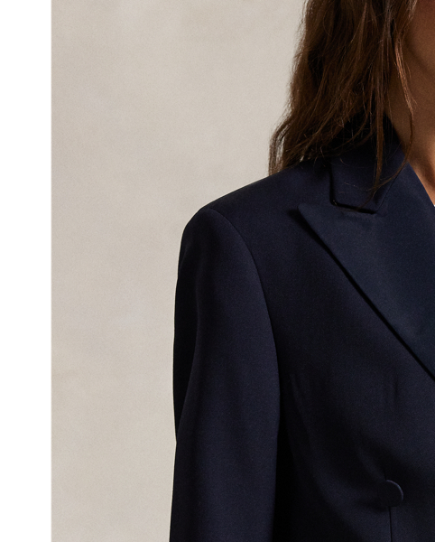 Tailored for a double-breasted silhouette with silk faille–covered buttons, this elegant blazer unites a luxurious Italian wool shell and silk peak lapels.