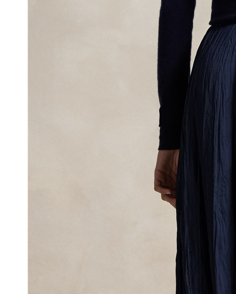 This satin skirt is cut for an A-line silhouette and features an allover crinkled texture.