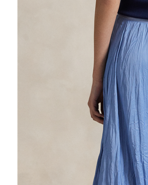 This satin skirt is cut for an A-line silhouette and features an allover crinkled texture.