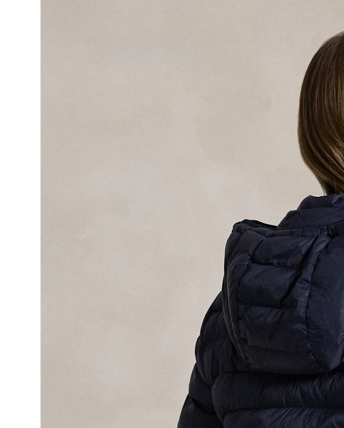 Made with water-repellent fabric, this quilted jacket features an insulating fill and a removable drawstring hood. It packs into its own pocket for easy storage and transport.