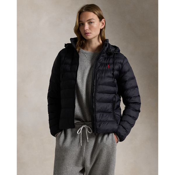 Made with water-repellent fabric, this quilted jacket features an insulating fill and a removable drawstring hood. It packs into its own pocket for easy storage and transport.
