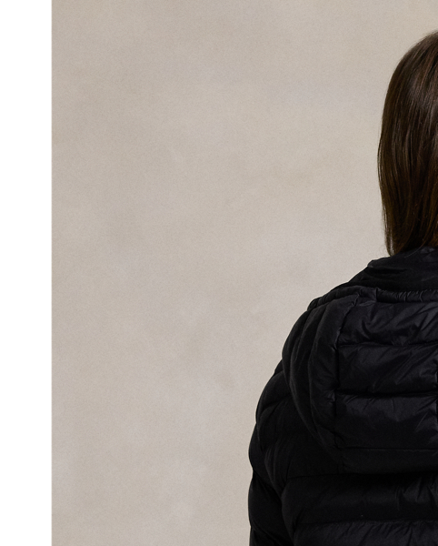Made with water-repellent fabric, this quilted jacket features an insulating fill and a removable drawstring hood. It packs into its own pocket for easy storage and transport.