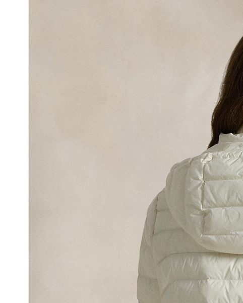 Made with water-repellent fabric, this quilted jacket features an insulating fill and a removable drawstring hood. It packs into its own pocket for easy storage and transport.