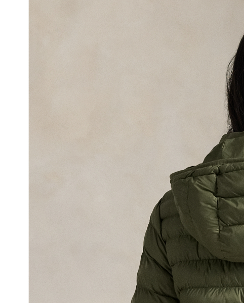 Made with water-repellent fabric, this quilted jacket features an insulating fill and a removable drawstring hood. It packs into its own pocket for easy storage and transport.