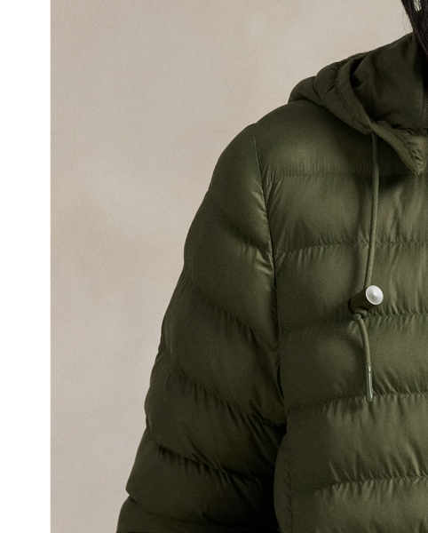 Made with water-repellent fabric, this quilted jacket features an insulating fill and a removable drawstring hood. It packs into its own pocket for easy storage and transport.