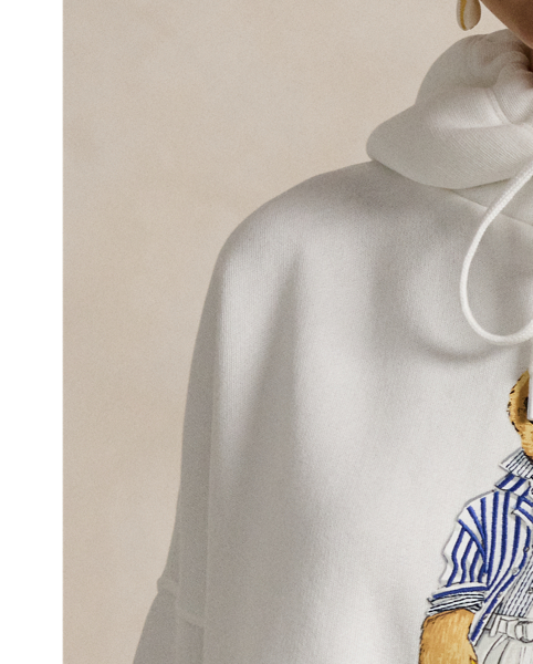  Ralph Lauren Lauren's signature logo and mascot, the Polo Bear, is rubber-printed at the front of this soft fleece hoodie.