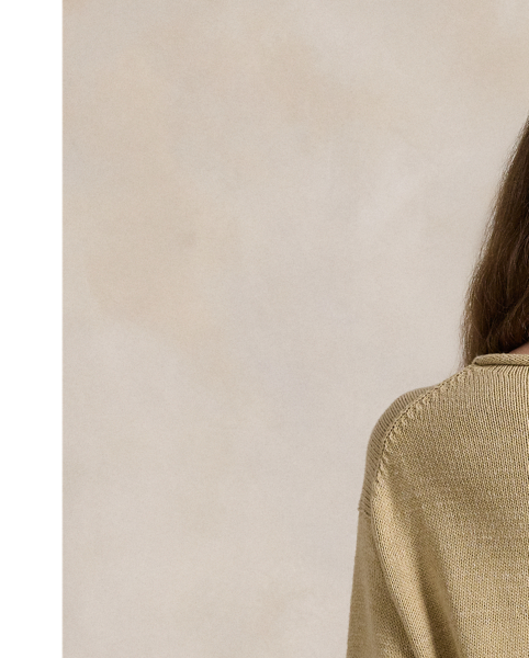 This rollneck jumper showcases an intarsia-knit rendering of the Polo Bear with hand-embroidered and beaded details.