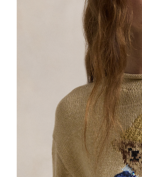 This rollneck jumper showcases an intarsia-knit rendering of the Polo Bear with hand-embroidered and beaded details.