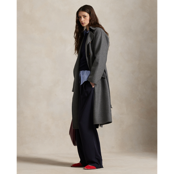 Heavyweight Italian cashmere brings luxurious warmth and softness to this double-breasted trench coat, which is finished with a buckled self-belt at the waist.