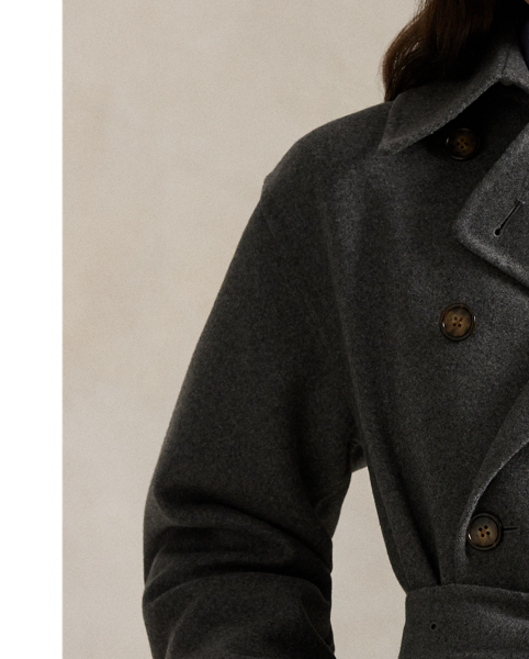 Heavyweight Italian cashmere brings luxurious warmth and softness to this double-breasted trench coat, which is finished with a buckled self-belt at the waist.