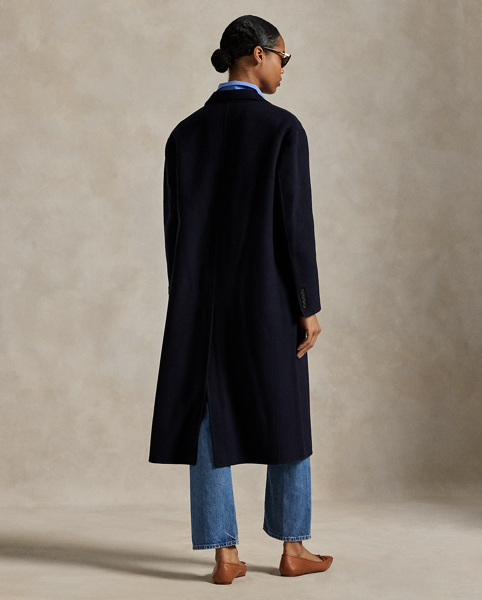 Rendered in double-faced brushed Italian wool for a sumptuous weight and drape, this overcoat is defined by traditional tailoring details. The oversize silhouette features notch lapels, waist darts and menswear-inspired besom pocketing.