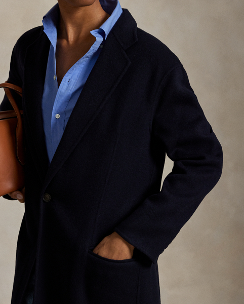 Rendered in double-faced brushed Italian wool for a sumptuous weight and drape, this overcoat is defined by traditional tailoring details. The oversize silhouette features notch lapels, waist darts and menswear-inspired besom pocketing.