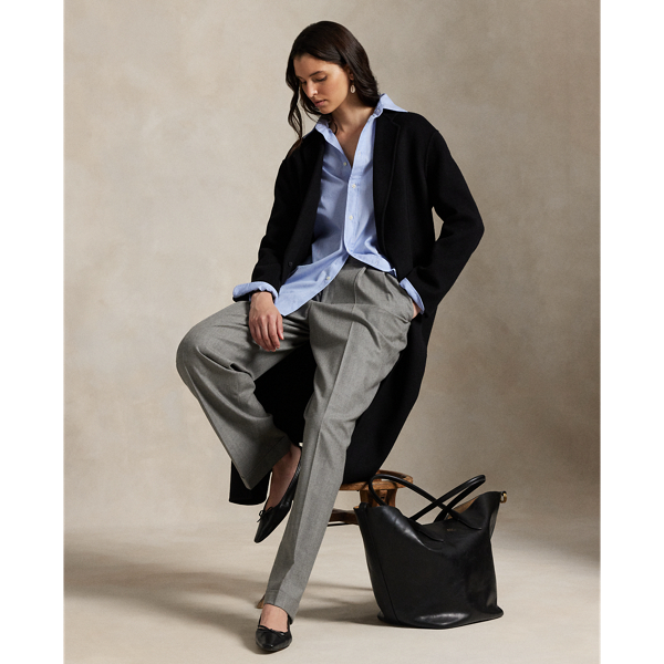 Rendered in double-faced brushed Italian wool for a sumptuous weight and drape, this overcoat is defined by traditional tailoring details. The oversize silhouette features notch lapels, waist darts and menswear-inspired besom pocketing.