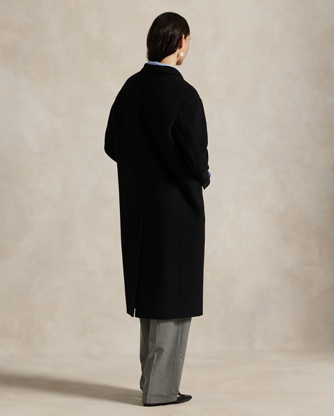 Rendered in double-faced brushed Italian wool for a sumptuous weight and drape, this overcoat is defined by traditional tailoring details. The oversize silhouette features notch lapels, waist darts and menswear-inspired besom pocketing.
