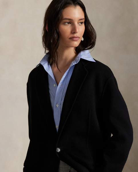 Rendered in double-faced brushed Italian wool for a sumptuous weight and drape, this overcoat is defined by traditional tailoring details. The oversize silhouette features notch lapels, waist darts and menswear-inspired besom pocketing.