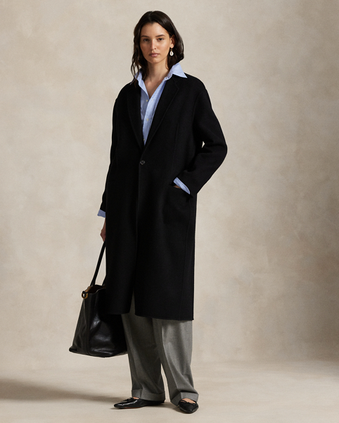 Rendered in double-faced brushed Italian wool for a sumptuous weight and drape, this overcoat is defined by traditional tailoring details. The oversize silhouette features notch lapels, waist darts and menswear-inspired besom pocketing.
