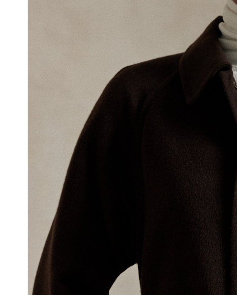 Italian wool and cashmere come together to create this version of the classic balmacaan coat, which is cut for a relaxed fit and paired with a buckled self-belt.