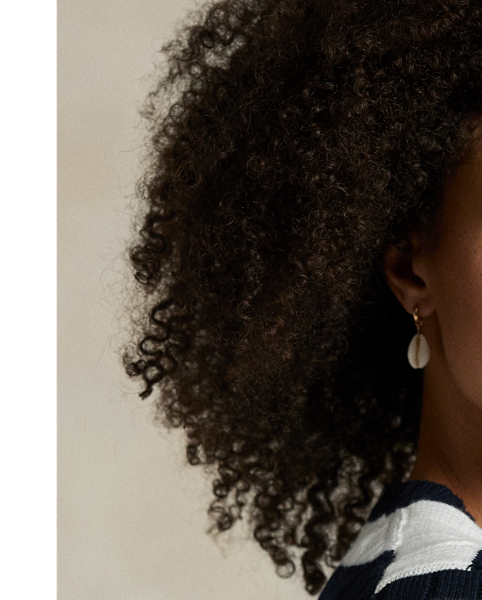 As a boy growing up in the Bronx, Mr Lauren loved going to Yankee Stadium™ to watch his hometown heroes play ball. This cable-knit cotton jumper celebrates Mr Lauren's long-standing love of the Bronx Bombers™ and the game of baseball with a felt patch of the New York Yankees™ logo.